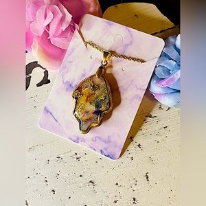 And made polymer clay necklace with Crystal accent